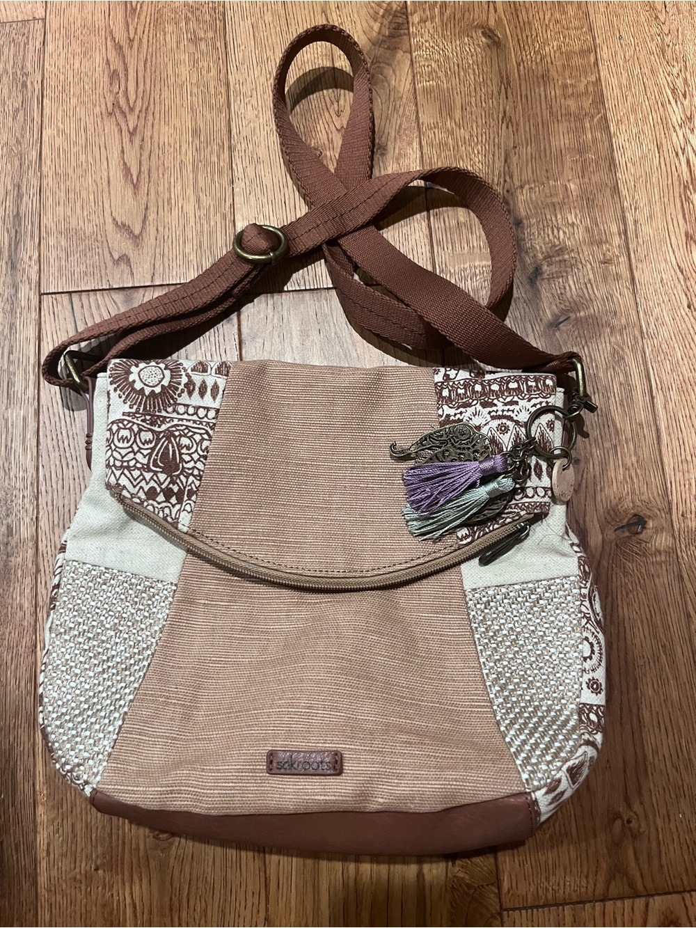 Sakroots Brown and Cream Patchwork Crossbody with Tassel Charm. Artist Circle